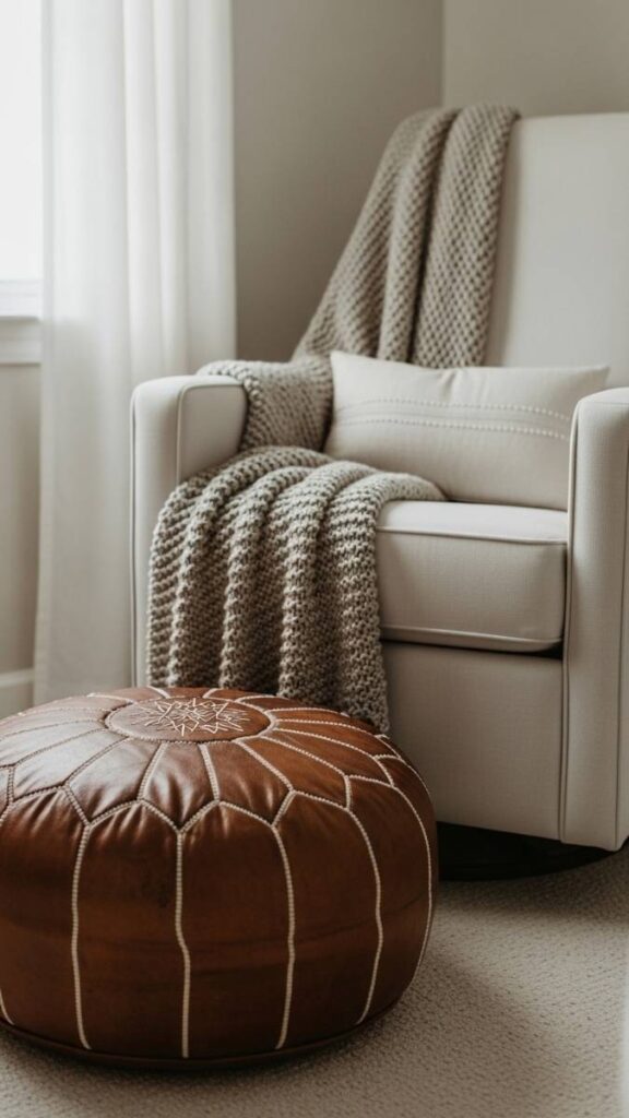 A Worn Leather Pouf as a Footrest Near the Glider
