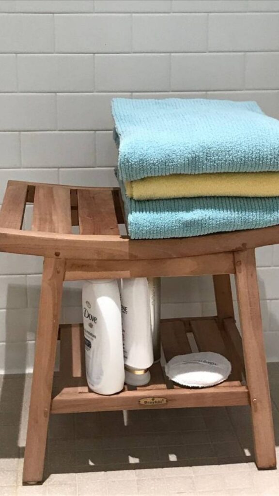 25+ Bathroom Decor Ideas That Actually Make Small Spaces 8 A Bamboo or Teak Footstool for Spa Feel Elevation