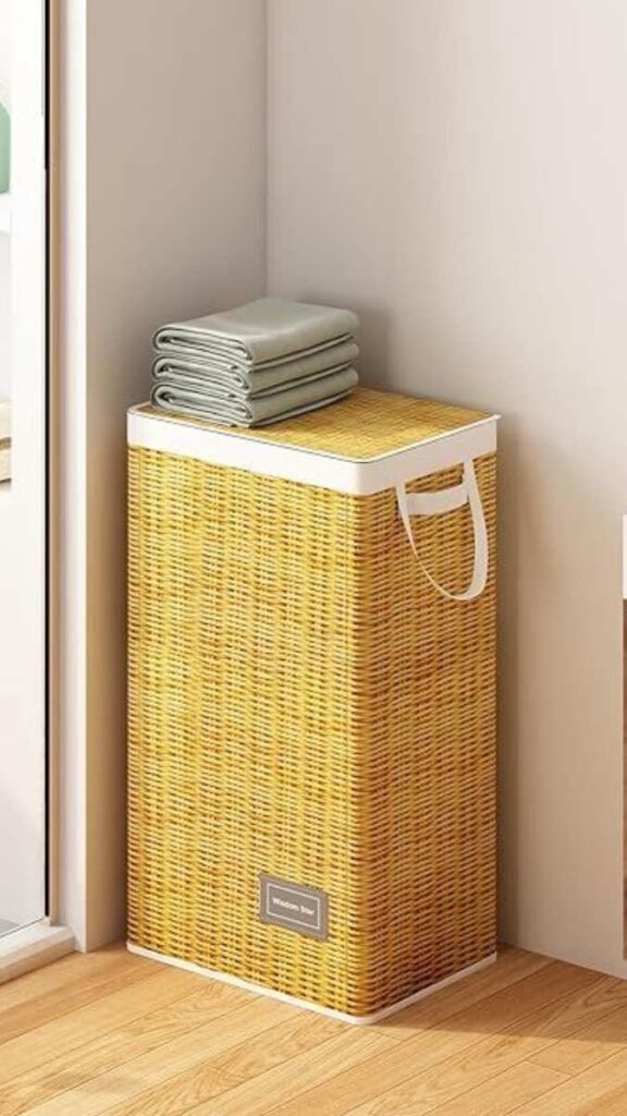 25+ Bathroom Decor Ideas That Actually Make Small Spaces 3 A Linen or Bamboo Hamper That Doubles as a Side Surface