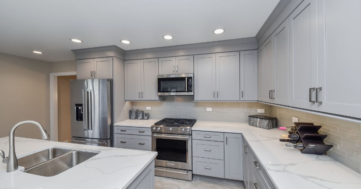 Modern kitchen with gray cabinets and marbleKitchen Counter Organization Ideas