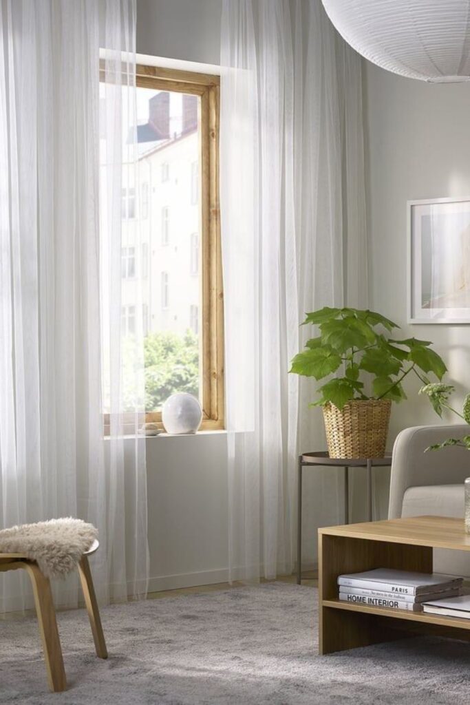 23+ Living Room Ideas That Actually Make Small Spaces Feel Bigger 8 Swap Heavy Curtains for Light, Sheer Panels