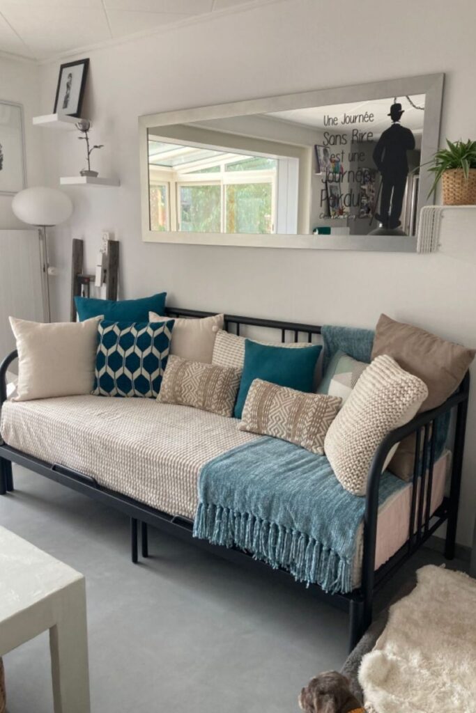 23+ Living Room Ideas That Actually Make Small Spaces Feel Bigger 11 Use a Daybed Instead of a Sofa in Multi-Use Rooms